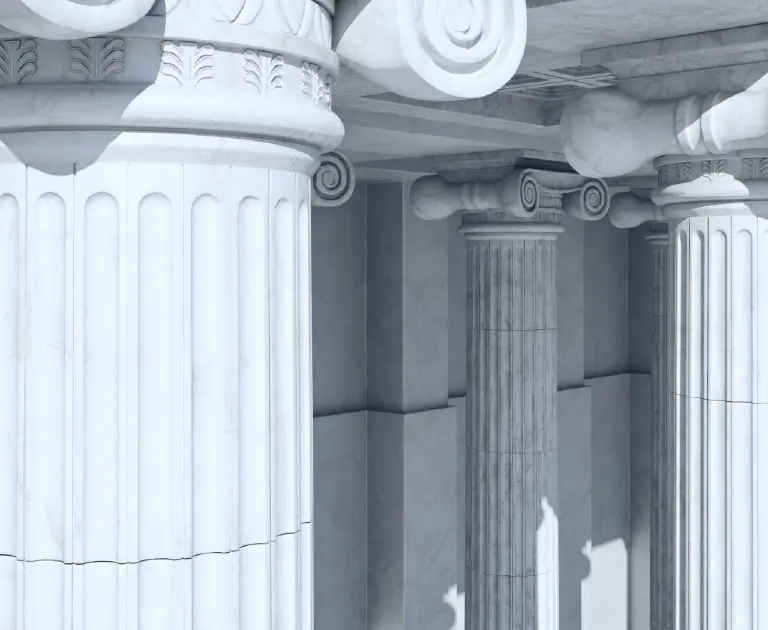 a row of white pillars sitting next to each other